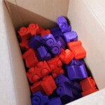 A box of 3D Printed Trucks for Toys for Tots.