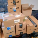 Sealed boxes of 3D printed toys for a holiday donation.